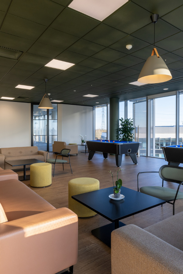 Breakout area with pool tables and sofas